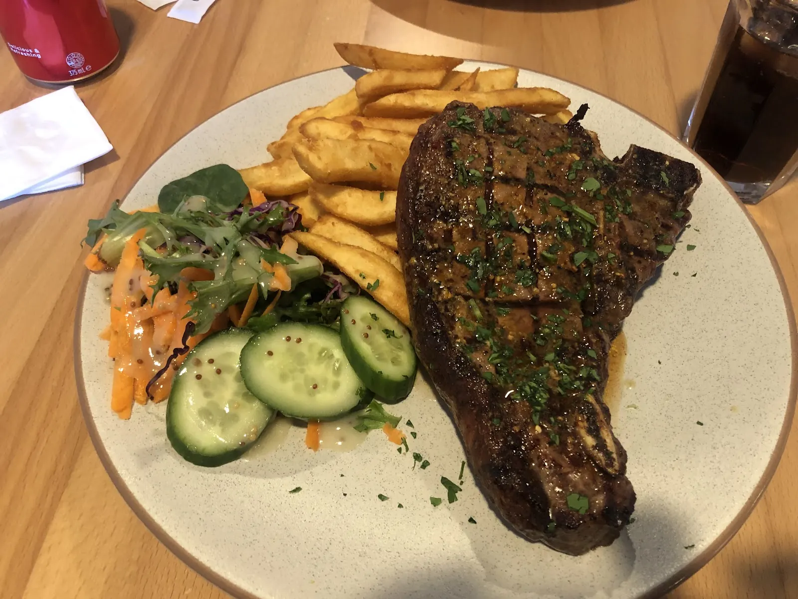A rump steak with chips and salad